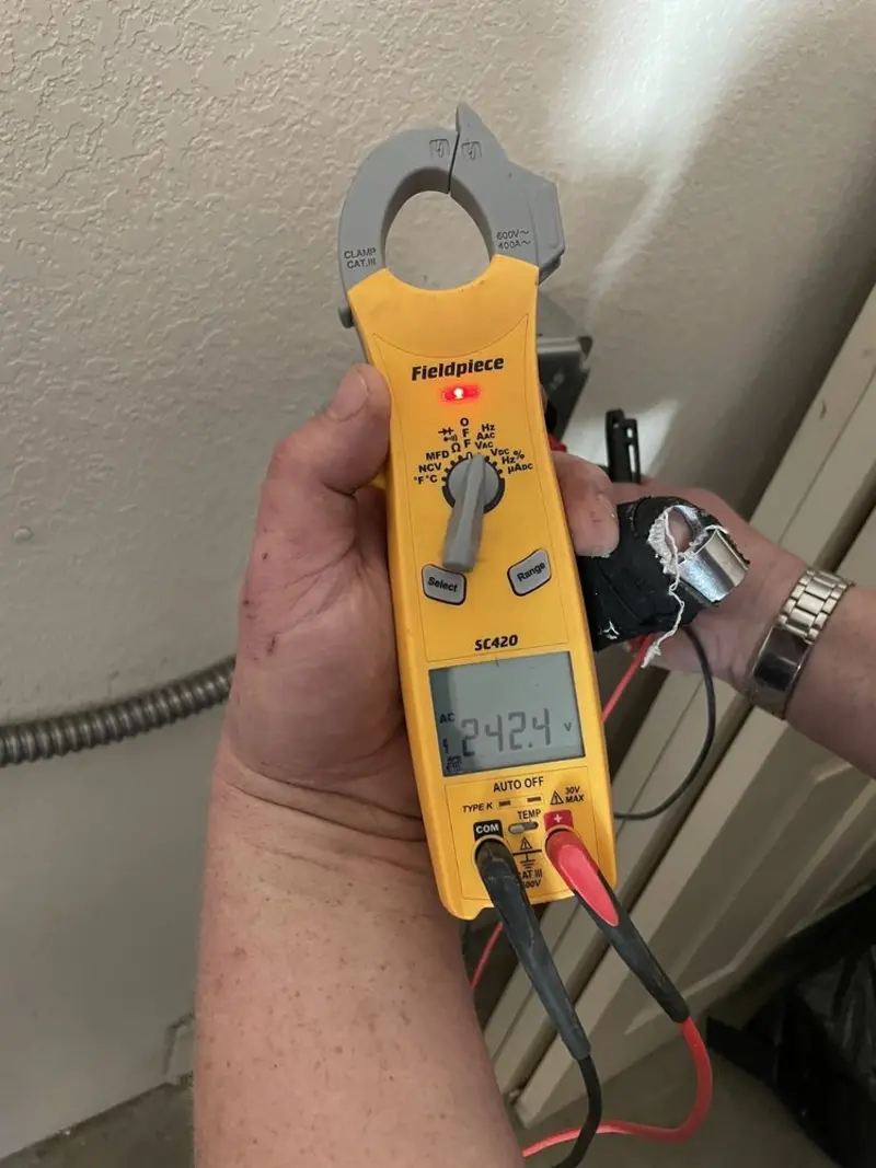 Voltage testing with clamp meter during Ceiling Fan Installation in Nockamixon